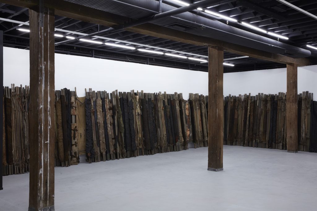  Ibrahim Mahama, A Grain of Wheat, 2015-18, mixed media. Installation view (2020) for the 22nd Biennale of Sydney, Artspace. Courtesy the artist and White Cube, London / Hong Kong. Photograph: Zan Wimberley