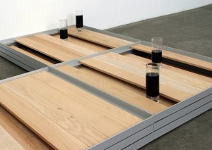 Liam Gillick follow Literally No Place Barfloor, 2000 aluminum, oak planks, 4 glasses, Pepsi © Liam Gillick Courtesy Casey Kaplan, New York