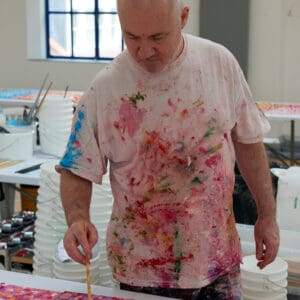 Damien Hirst in studio, 2019. Photographed by Prudence Cuming Associates Ltd © Damien Hirst and Science Ltd. All rights reserved, DACS 2022.