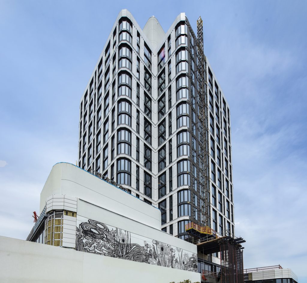 Artist Swoon creates gigantic mural on 23-story, terra-cotta and glass tower The Dime