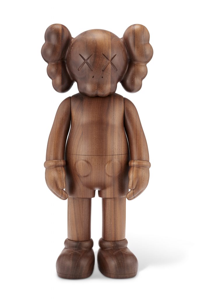 KAWS (B.1974) COMPANION (KARIMOKU VERSION) signed and numbered 'KAWS..42/100' and stamped '???? [KARIMOKU] OriginalFake' (on the underside) wood multiple, with the original packaging, box and hologram Overall: 101?2 x 5 x 21?2 in. (26.7 x 12.7 x 6.4 cm.) Executed in 2011. This work is number 42 from the edition of 100. Co-published by OriginalFake and Karimoku, Tokyo. FADmagazine