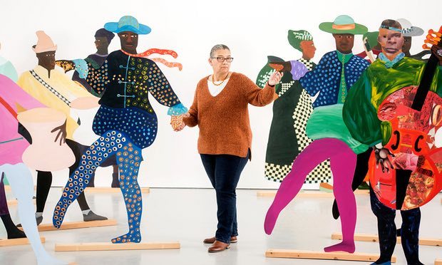 Lubaina Himid with her signature cut-out artworks, representing African slaves in 18th-century royal European courts. Photograph: Adrian Sherratt