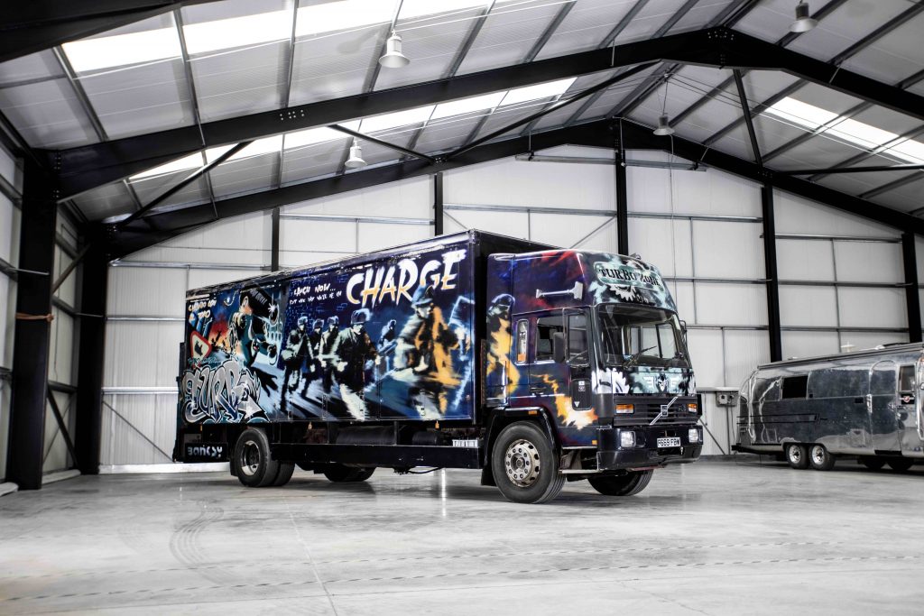 A 17-ton truck covered in Banksy artwork is up for auction at the Goodwood Revival sale. FAD magazine