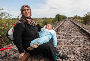 Syrian refugees, Roszke, Hungary, 2015. Refugees entering Hungary at the Serbian-Hungarian border near Roszke, enroute to Budapest. © Antonio Olmos.