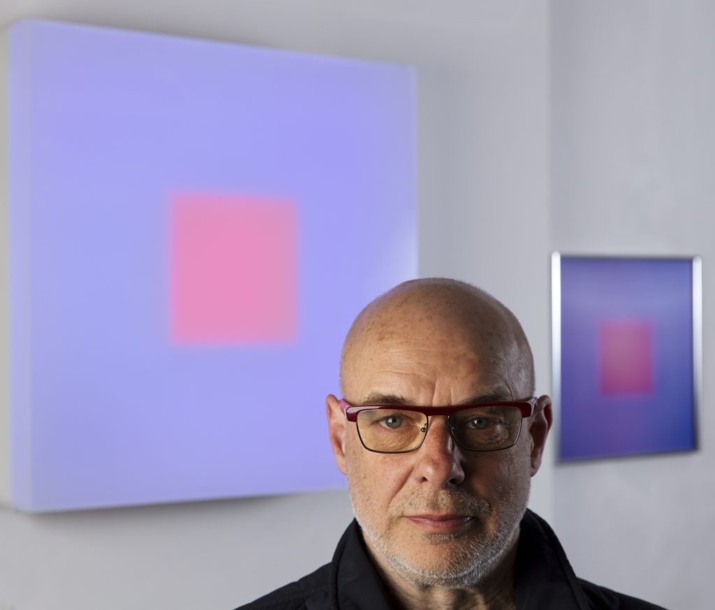 Brian Eno, musician and artist in his studio with lightbox and lenticular. April 2016