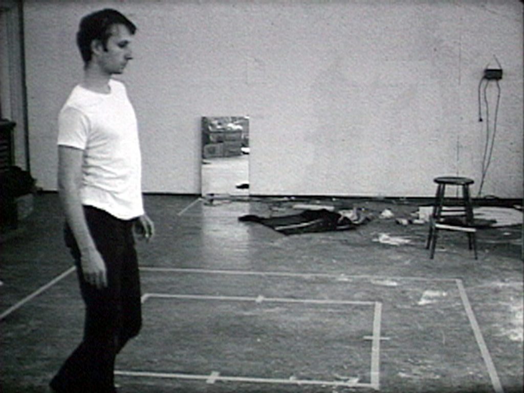 Bruce Nauman  Walking in an Exaggerated Manner Around the Perimeter of a Square 1967–1968  16mm film on video, projected, black and white, sound  10min  Exhibition file courtesy Electronic Arts Intermix (EAI), New York  © ARS, NY and DACS, London 2020? FAD magazine 