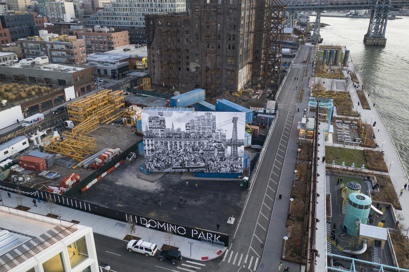 JR reveals “The Chronicles of New York” the largest outdoor mural to