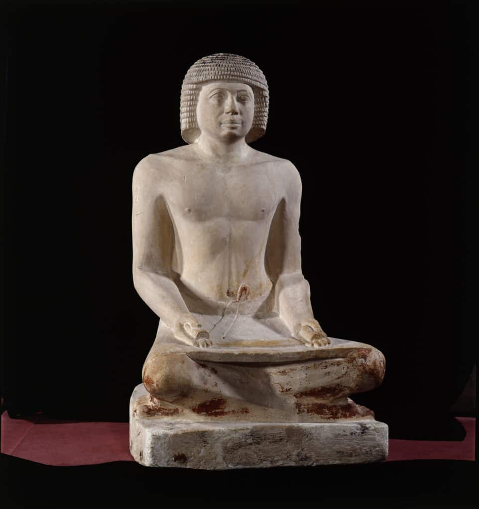 Statue of a scribe, limestone, Egypt, 6th Dynasty. Photo (C) Musée du Louvre, Dist. RMN-Grand Palais / Georges Poncet