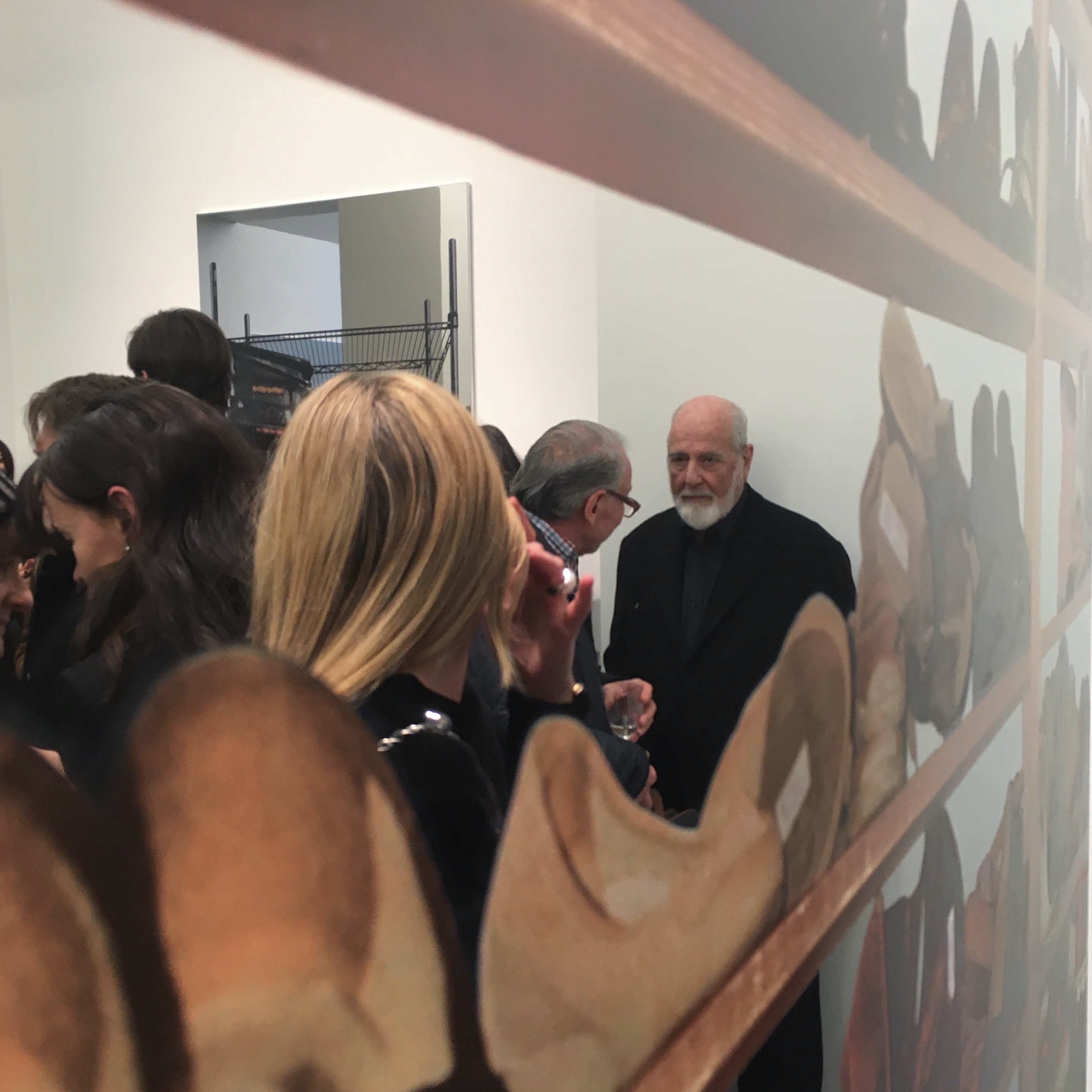 Michelangelo Pistoletto reflected in his own work at Simon Lee's Scaffali preview. FAD MAGAZINE