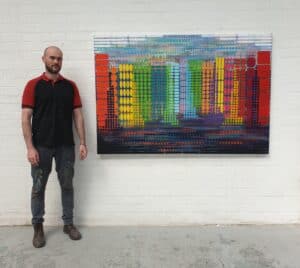 Kieran Flynn with his painting Jungle No2