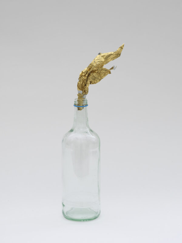 Gavin Turk Fire Water Gold foil, glass bottle and shelf 36.2cm x 9.8cm x 7.7cm 2019
