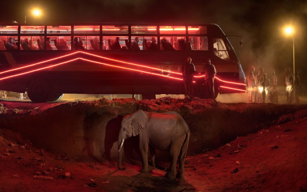 Nick Brandt, 'Bus Station with Elephant & Red Bus' (2018) © Nick Brandt & Atlas Gallery