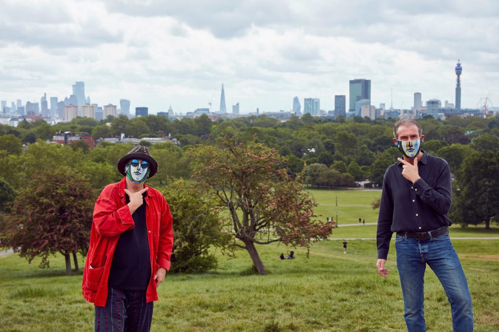 Ron Arad and Maurice Ostro was taken on Primrose Hill – and they are making the sign for ‘Smile’ in British Sign Language
