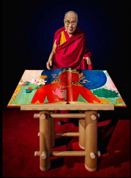Tenzin Gyatso, the Fourteenth Dalai Lama, with a draft copy of Murals of Tibet, Boston, 2014. FAD MAGAZINE