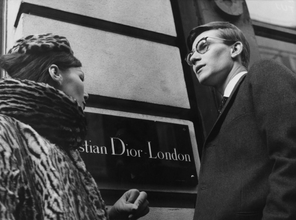 French fashion designer Yves Saint Laurent (1936 - 2008) in London, 11th November 1958. He is preparing for the following day's Dior Autumn collection show to an audience including Princess Margaret, at Blenheim Palace. (Photo by Popperfoto/Getty Images