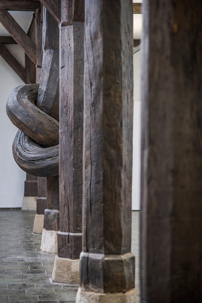 Aritist Alex Chinneck ties a knot in 450-year-old column 