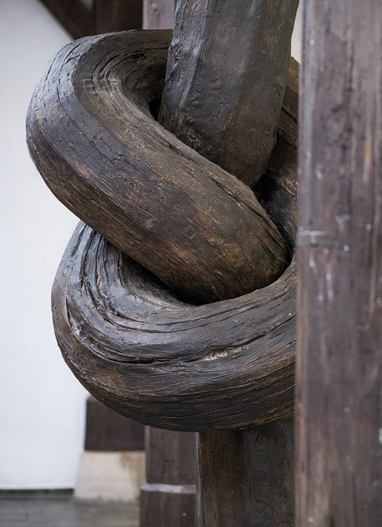 Aritist Alex Chinneck ties a knot in 450-year-old column 