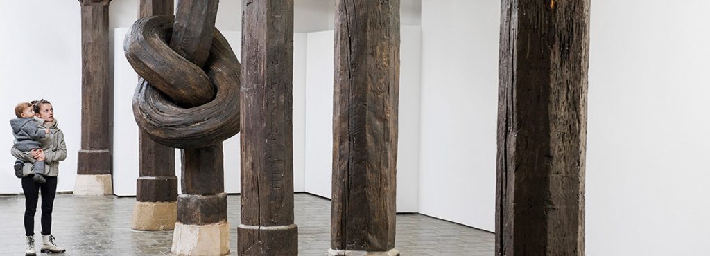 Aritist Alex Chinneck ties a knot in 450-year-old column 