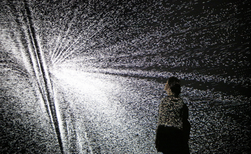 LONDON, ENGLAND - DECEMBER 02: A visitor looks at an installation by artist Ryoji Ikeda at the Big Bang Data exhibition at Somerset House on December 2, 2015 in London, England. The show highlights the data explosion that's radically transforming our lives. It opens on December 3, 2015 and runs until February 28, 2016 at Somerset House. (Photo by Peter Macdiarmid/Getty Images for Somerset House)