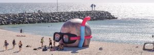Inflated Damien Hirst head pops up on beach FAD MAGAZINE