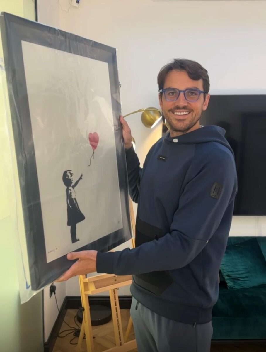 CEO James Ryan with the returned Banksy artwork