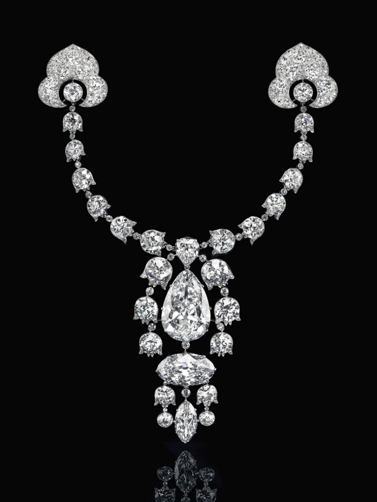 Devant-de-Corsage brooch, 1912, Cartier. Pear brilliant-cut diamond of 34.08 carats, oval brilliant-cut diamond of 23.55 carats, modified marquise brilliant-cut diamond of 6.51 carats, heart modified brilliant-cut diamond of 3.54 carats, lily-of-the-valley old-cut diamond links, platinum and 18k white gold (French marks), 7½ in, 1912. Signed Cartier